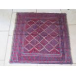 A hand knotted woollen Gazak rug - 117x115cm