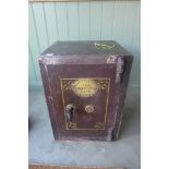A vintage safe by Thomas Perry and son - with key, 61cm tall x 43cm x 40cm