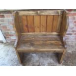 A pine small settle, approx 80cm W x 91cm H x 41cm D - made by a local craftsman to a high standard