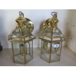 A pair of modern brass lantern ceiling lights, with bevel edge glass, 33cm tall