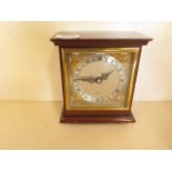 An Elliott of London mantle clock with brass and silvered dial 8 day movement, 15cm tall, in good