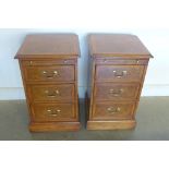 A pair of oak bedside chests, with a brushing slide, and three drawers, made by a local craftsman to