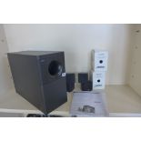 A pair of Bose Acoustimass 5 series cube speakers, and a Bose subwoofer, with instructions, no