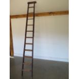 A Georgian pine eleven rung library ladder, 266cm H x 36cm W - removed from a Cambridge College