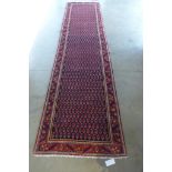 A hand knotted woollen Araak, Botteh design runner, approx 387cm x 97cm - in good condition