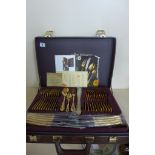 A SBS Bestecke Solingen gold plated twelve setting canteen of cutlery in fitted case, in unused