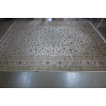 A hand knotted woollen Kashan rug, 392cm x 294cm - in generally good condition