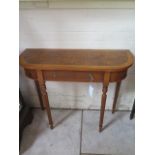 A walnut hall table with a single drawer on turned reeded legs, 77cm tall x 92cm x 33cm - made by