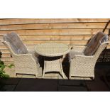 A Bramblecrest Patagonia bistro set with two armchairs with cushions, RRP £517, ex display