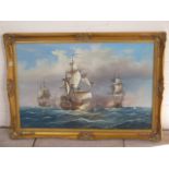 An oil on canvas, seascape battle at sea, signed J Harvey, in a gilt swept frame, 74cm x 104cm