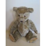 A vintage mohair teddy bear, 46cm tall, some play wear but generally good
