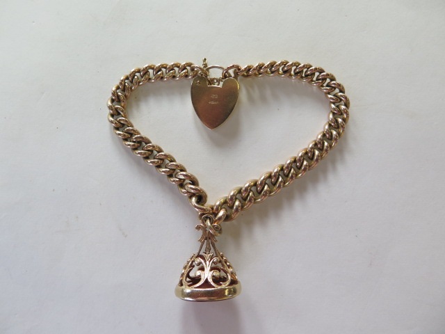 A 9ct yellow gold bracelet with a fob, converted from an Albert watch chain, approx total weight