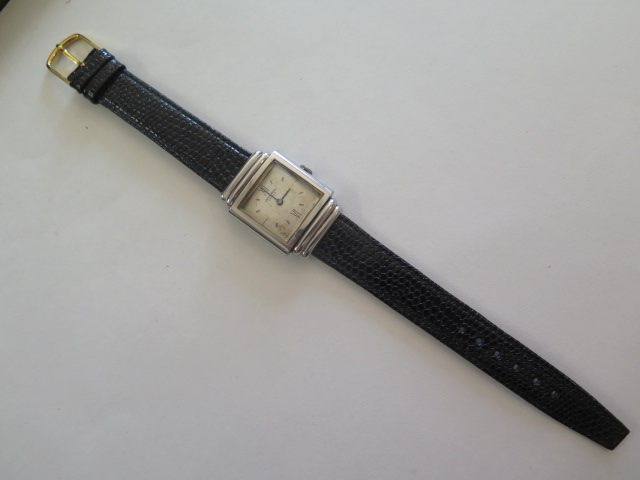 A gents steel case Universal Geneve wrist watch, square Art Deco style case with stepped shoulders