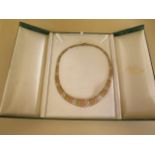 A 9ct tri-colour gold necklace, approx 29.8 grams - in good condition