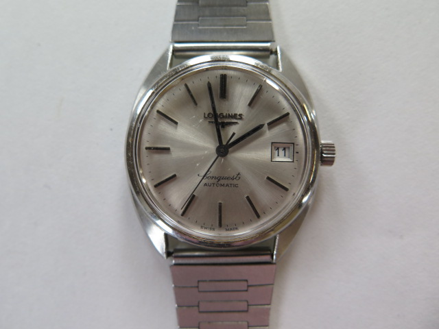 A gents Longines conquest automatic wrsitwatch with a Speidel stainless steel strap, in working