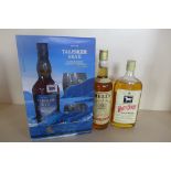 A Talisker Skye Atlantic Challenge boxed whisky and glass set, a bottle of Bells Old Scotch whisky