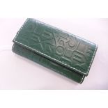 A Rolex green leather key wallet, embossed case, with Rolex name repeated design, stamped Rolex