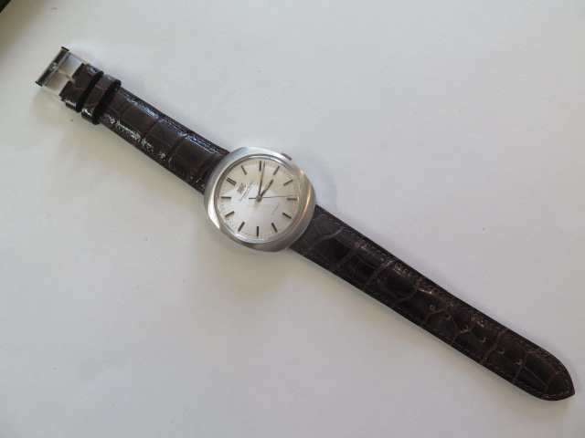 An interesting gents IWC automatic steel cased wrist watch, brushed steel tonneau style case,