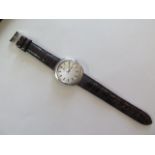 An interesting gents IWC automatic steel cased wrist watch, brushed steel tonneau style case,