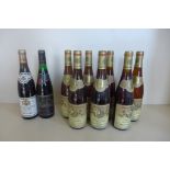 seven bottles of 1976 Rheingan Riesling, a 1976 bottle of Riesling white wine, and a 1987 bottle