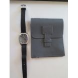 A fine gents Jaeger Le Coultre steel wrist watch, coffin shape case, with black dial and roman