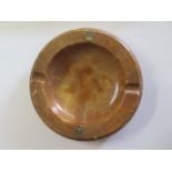 A brown alabaster Rolex ashtray with gold crown mounts, diameter 20cm, some minor wear/flaking of