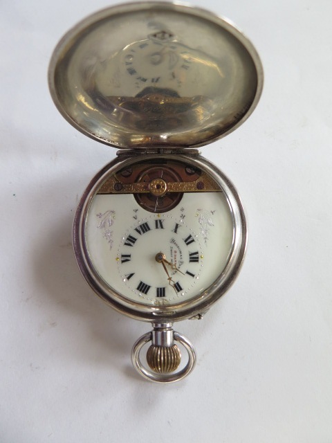 A silver Hebdomas 8 day gents pocket watch in working order, minor dents to case, slight damage to