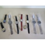 A collection of nine watches, four Quartz and five mechanical, working in the saleroom