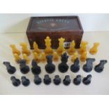 A Greys of Cambridge Silette chess set in Catalin polymer, black and amber colour, complete and in