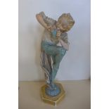 A sculpture in plaster of Peter Pan, initialed and dated 1928 - 41cm tall, ships and repair to foot,
