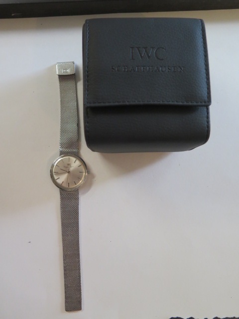 A gents steel cased IWC wrist watch and bracelet, the circular brushed steel finished dial with