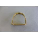 An 18ct gold stirrup measuring weight 29mm, width 29mm, weight approx 7.4 grams