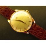A gents pink or rose 18ct gold Omega Geneve watch with champagne dial, with baton markers and