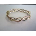 A 9ct tri-colour bangle, approx 19.2 grams, 7x6 cm - in generally good condition