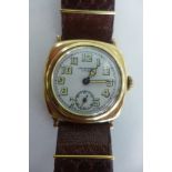 A JW Benson 9ct gold cushion cased wristwatch, white enamel face, with luninous Arabic numerals