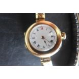 A very fine ladies 15ct gold Edwardian wristwatch, a very early design for a ladies watch, white
