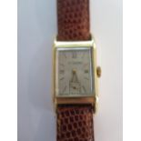 A fine gents Le Coultre 14ct gold wristwatch on lizard strap, rectangular dial marked Le Coultre