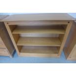 A Multi-York light oak bookcase with two shelves, 118cm W x 100cm H