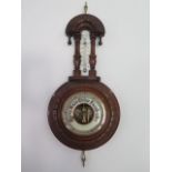 A pretty Victorian walnut carved barometer with thermometer, height 43cm