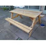A timber picnic bench
