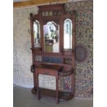 A Victorian mirror back walnut hall stand, with glove drawer, 209cm tall x 104cm wide