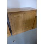 A Multi-York light oak cabinet with two doors as new 100cm W x 90cm H