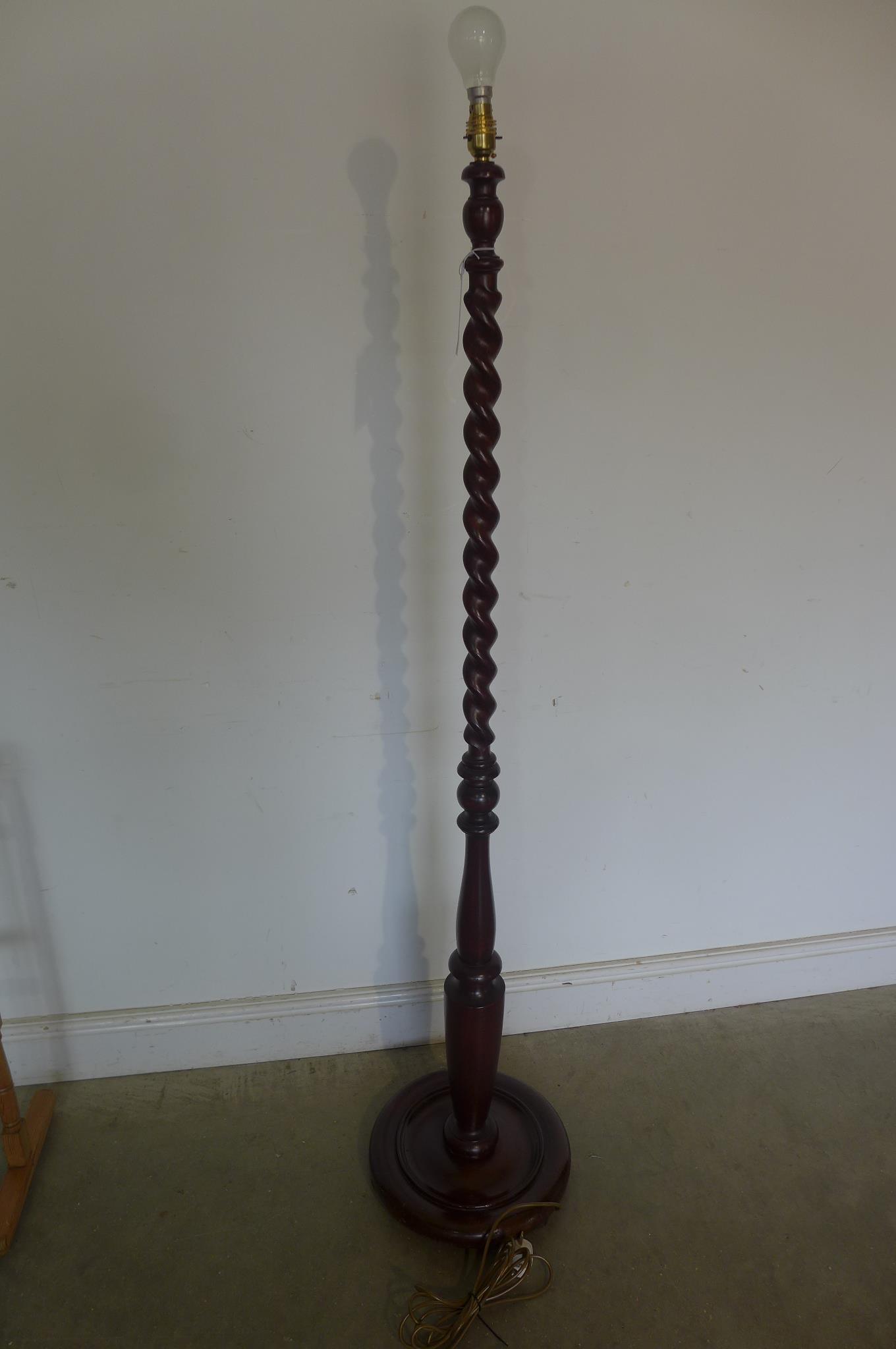 A mid 20th century barley twist mahogany standard lamp, tested and working, 158cm tall, polished