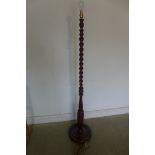A mid 20th century barley twist mahogany standard lamp, tested and working, 158cm tall, polished