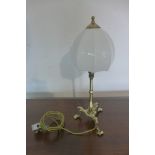 An Edwardian brass Pullman table lamp, tested and working, 49cm tall