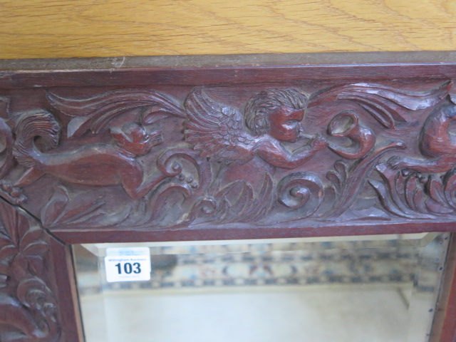 A carved hardwood mirror with a herald and animal detail, 60x52cm - Image 2 of 3