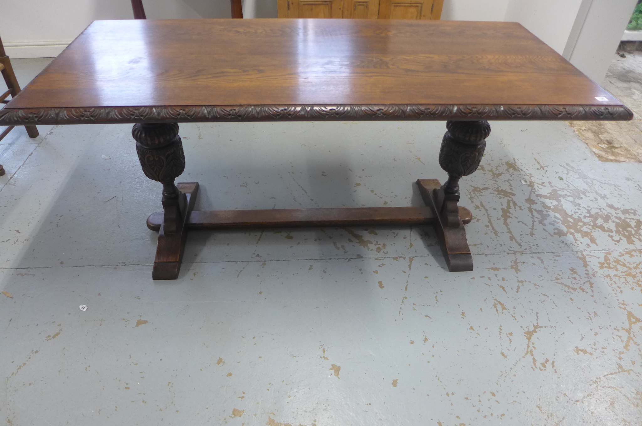 An oak refectory table on twin carved bulbous supports, 77cm tall x 175cm x 80cm - in sturdy