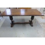 An oak refectory table on twin carved bulbous supports, 77cm tall x 175cm x 80cm - in sturdy