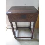 A late 17th/early 18th century oak bible box, with later stand, incorporating bobbin turned legs,