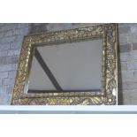 An ornate carved gilt mirror 79x101cm